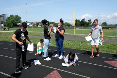 Drone image of students on the sidewalk